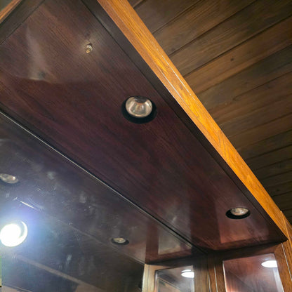 Close-up of a wooden surface with metallic fixtures