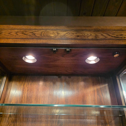 Wooden door with glass panel and light fixture