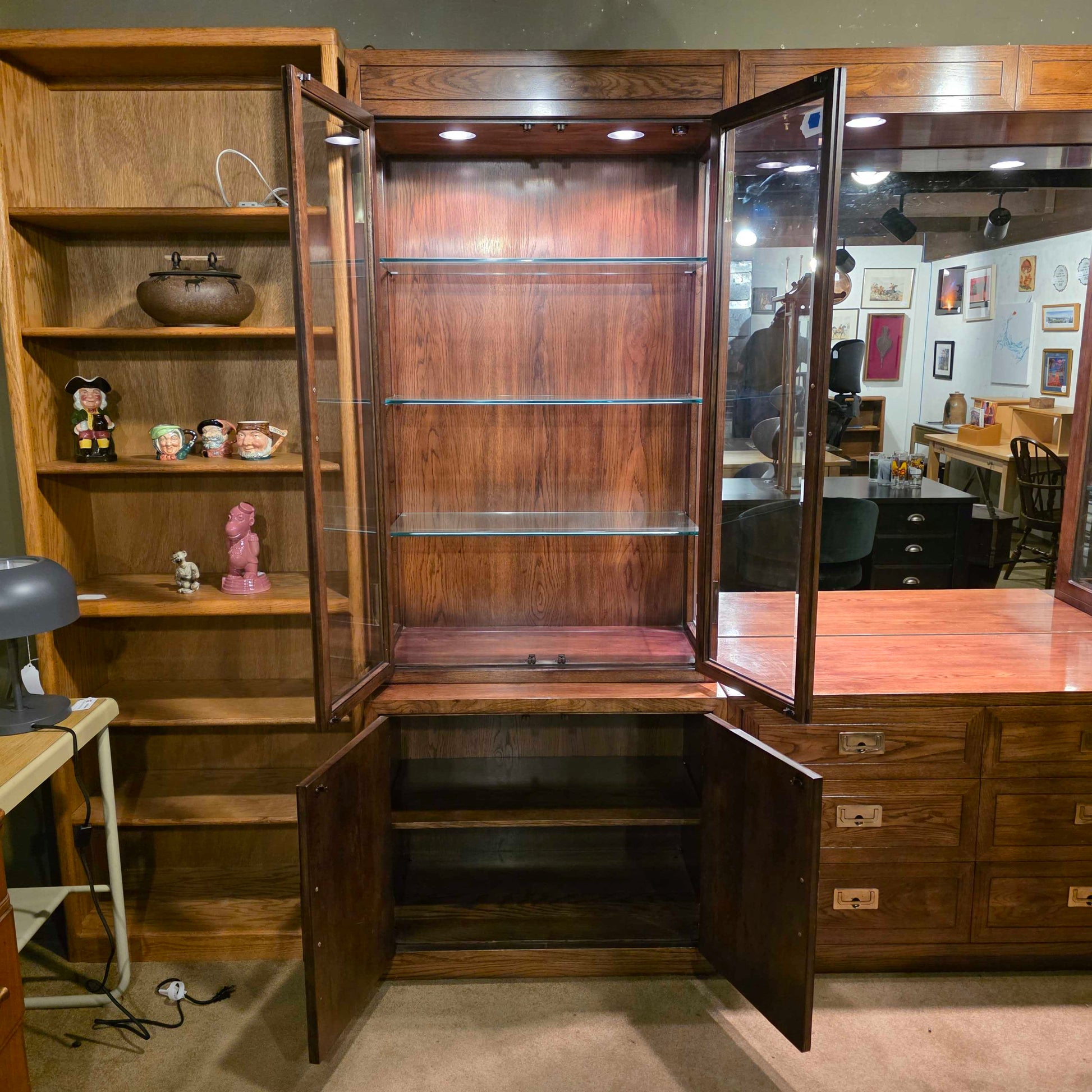 Wooden bar cabinet with glass top in a room setting