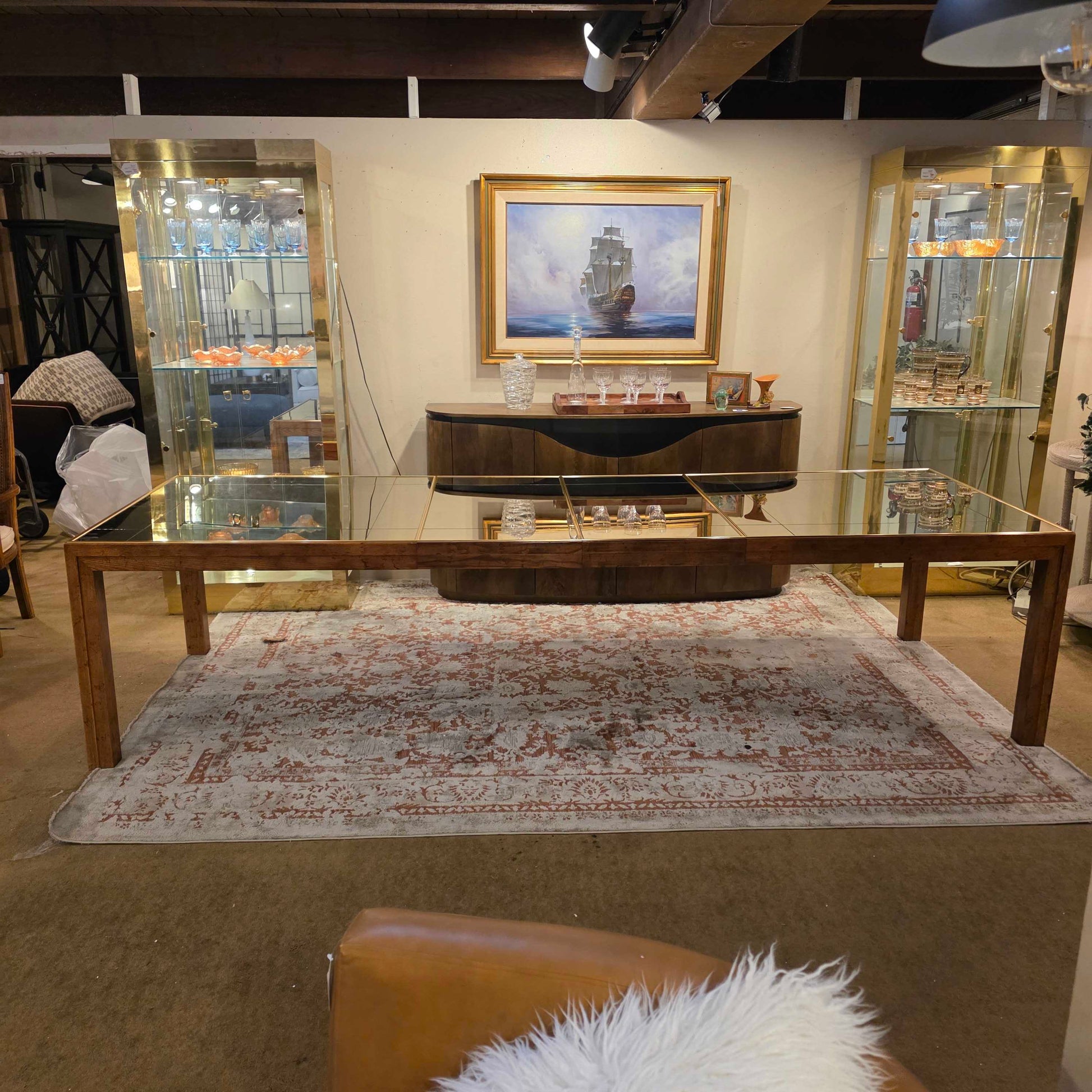 Room interior with a piano, mirror, and decorative items.