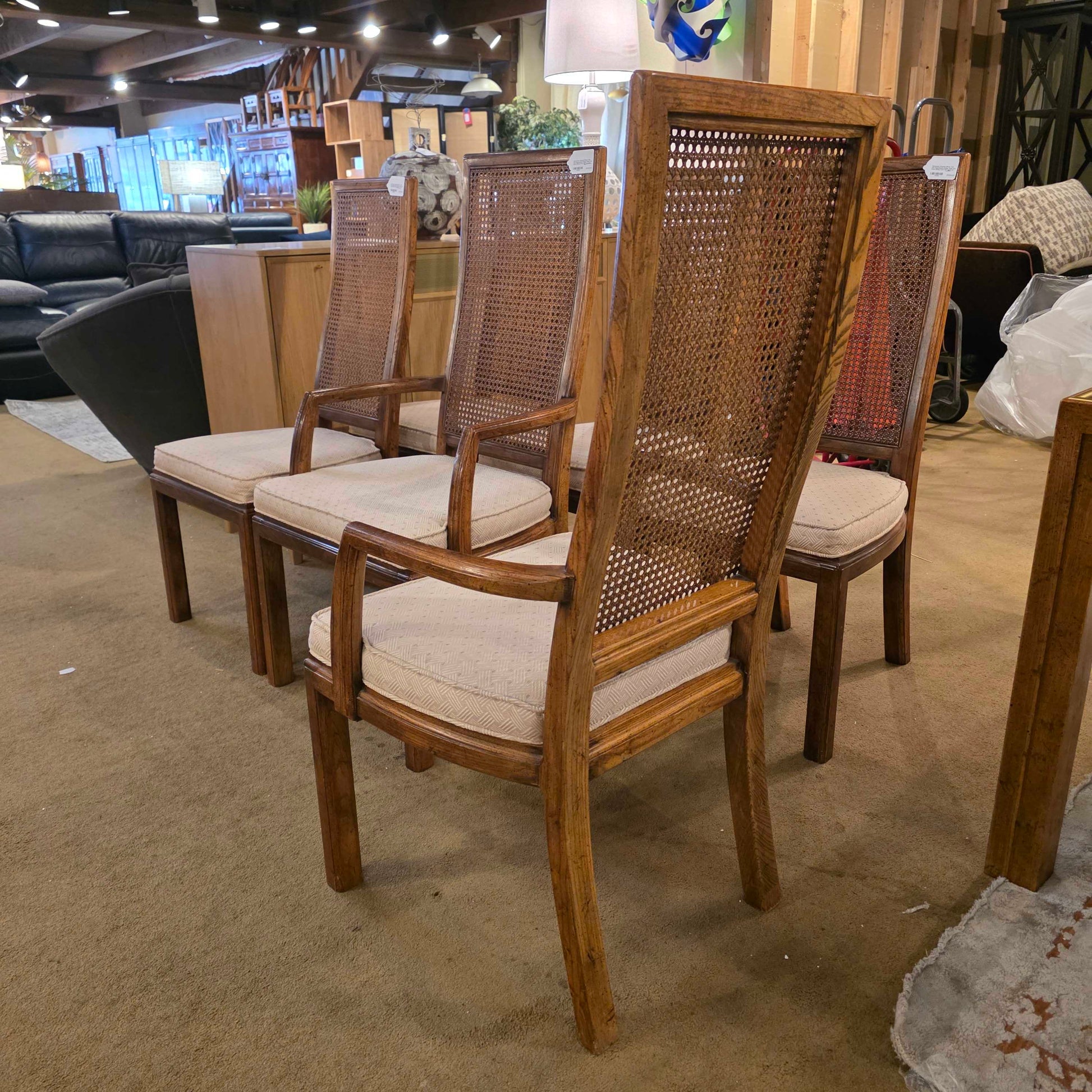 Wooden chairs with wicker backrests in a room setting