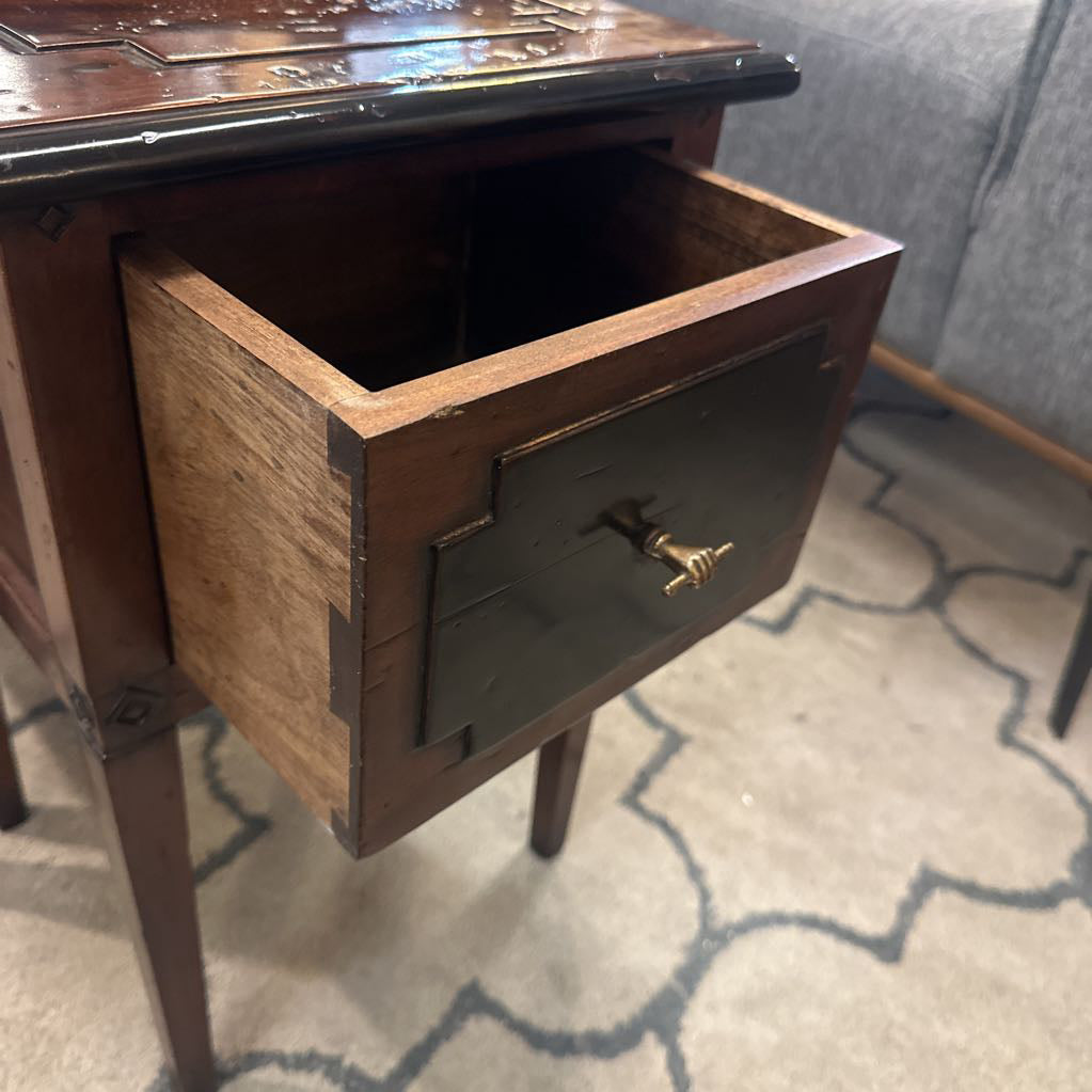 Wooden nightstand with a drawer open on a patterned rug