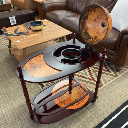 Decorative coffee table with world map design in a living room setting