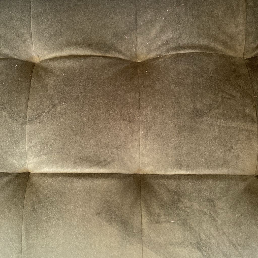 Close-up of a textured brown fabric surface