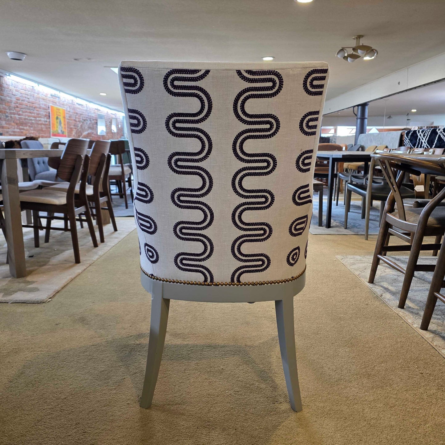 Chair with a black wavy pattern on a beige background