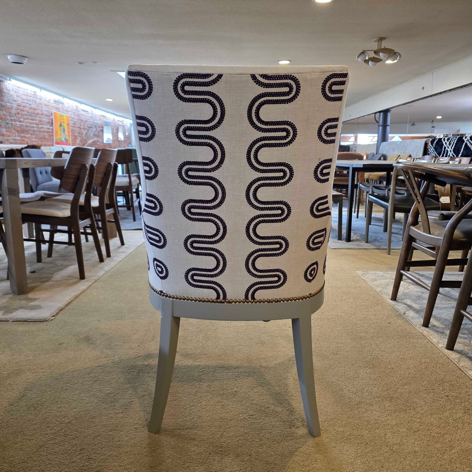 Chair with a black wavy pattern on a beige background