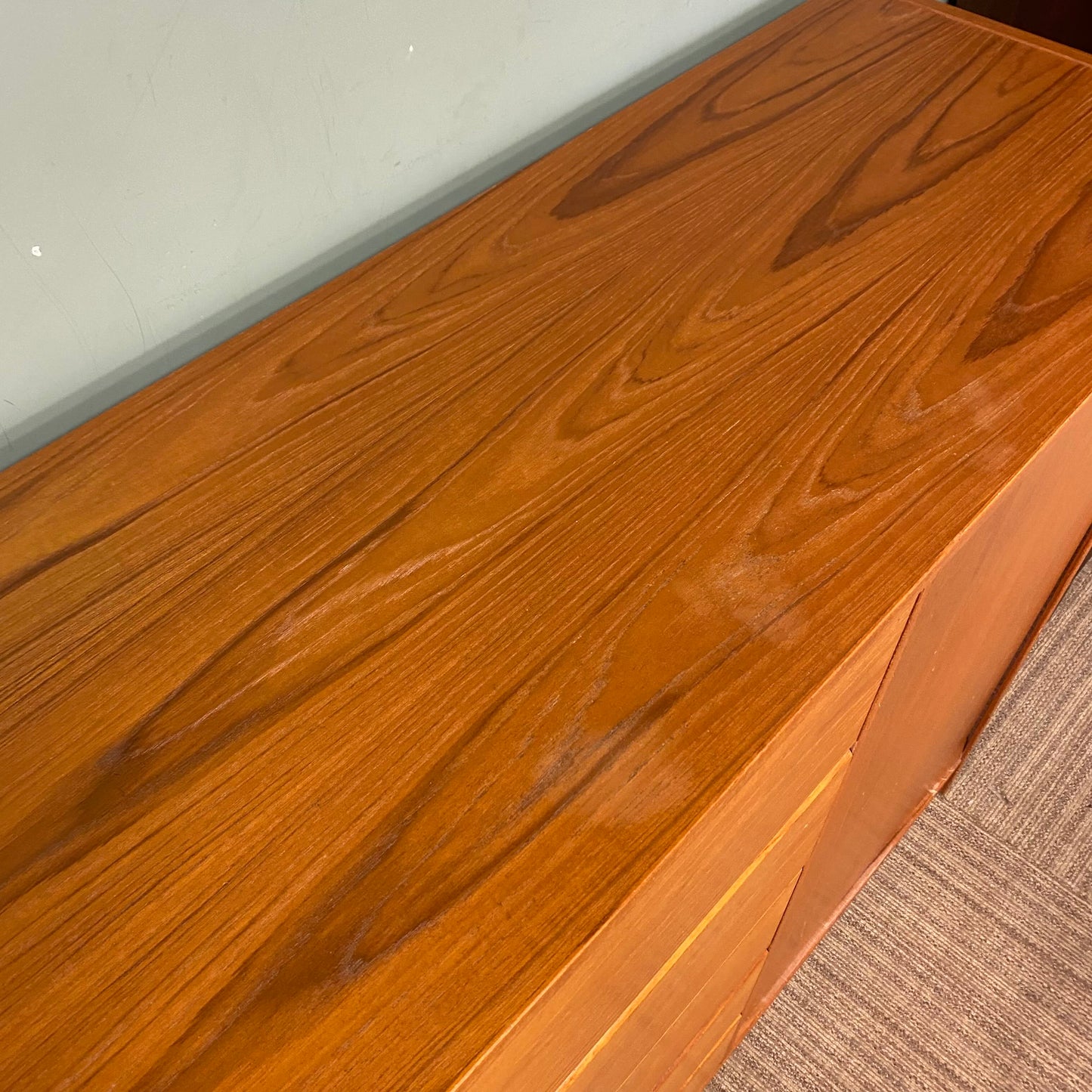 Close-up of a wooden surface with a light wood finish.