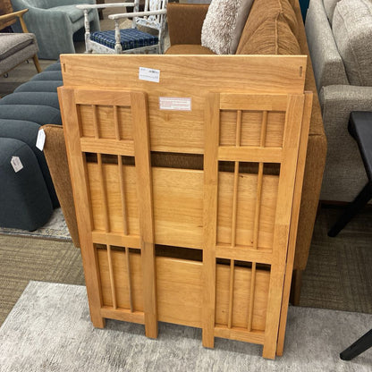 Wooden folding screen in a furniture store setting