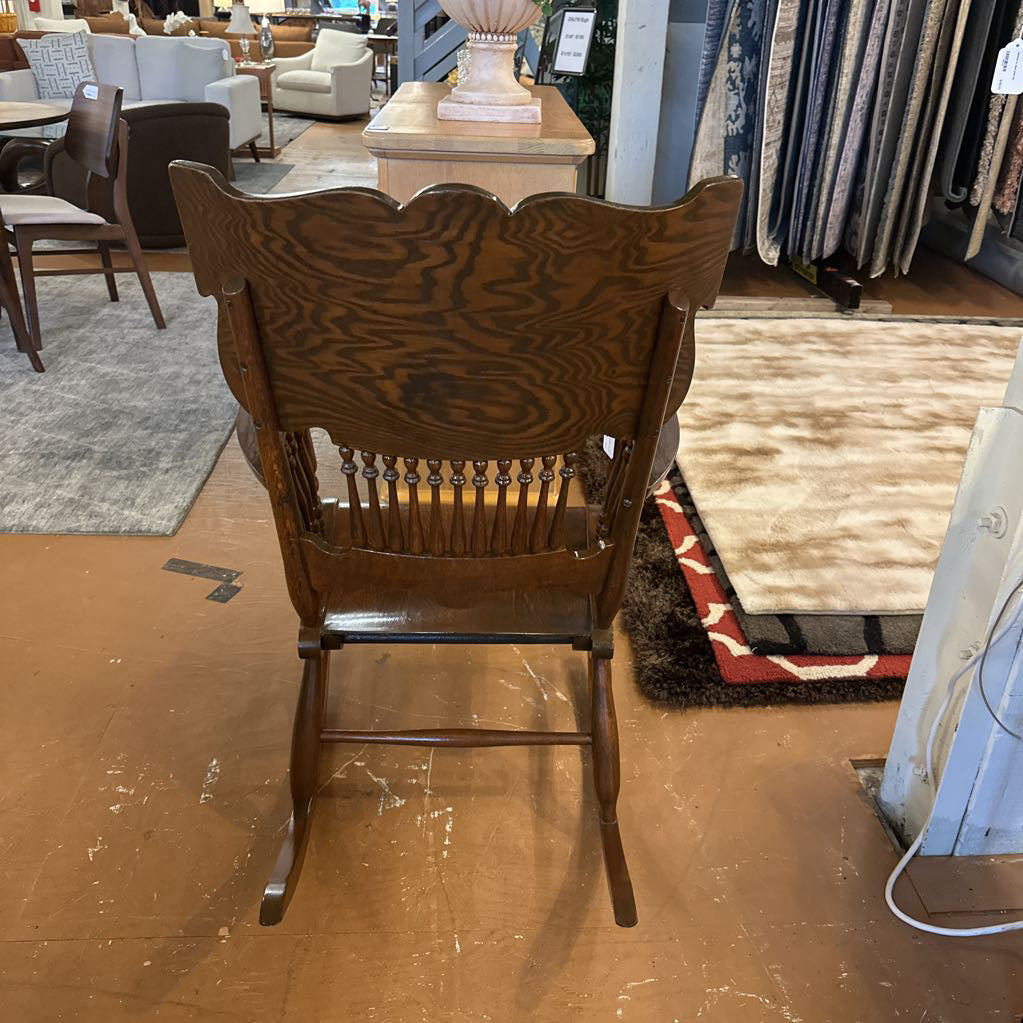 Wooden rocking chair in a furniture store setting