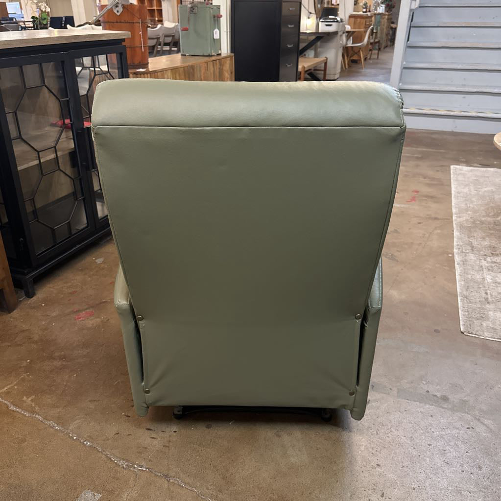 Green refrigerator with a cover in an indoor setting