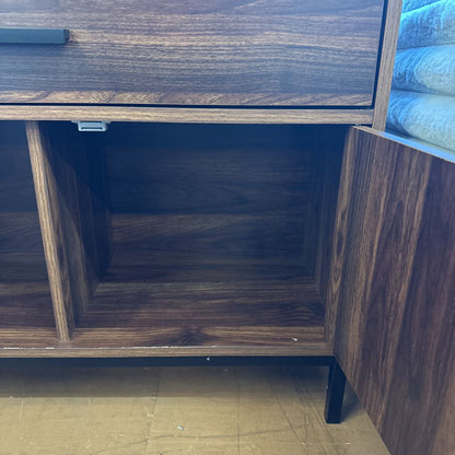 Wooden cabinet with open door revealing a dark interior.