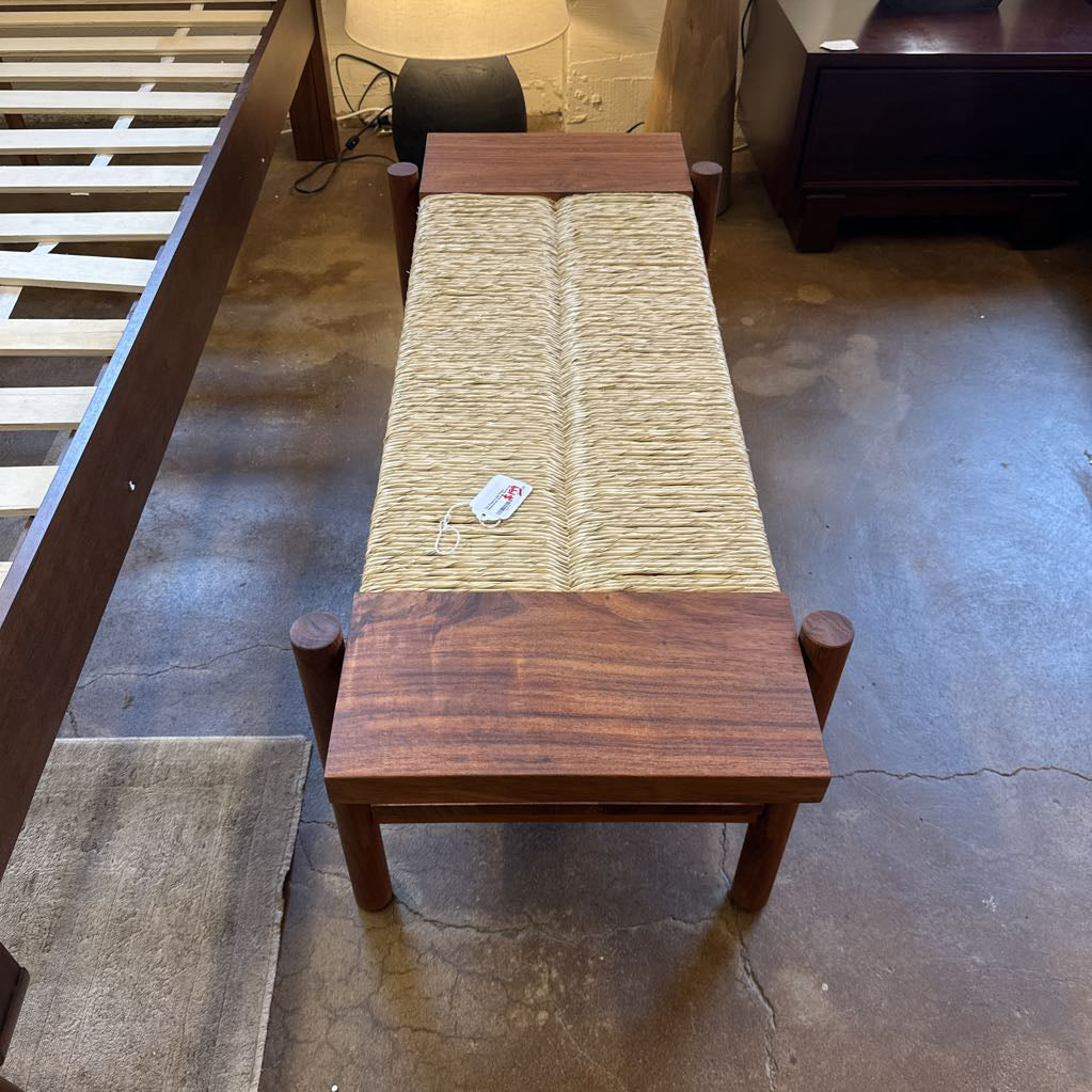 Wooden bench with textured top in a room setting