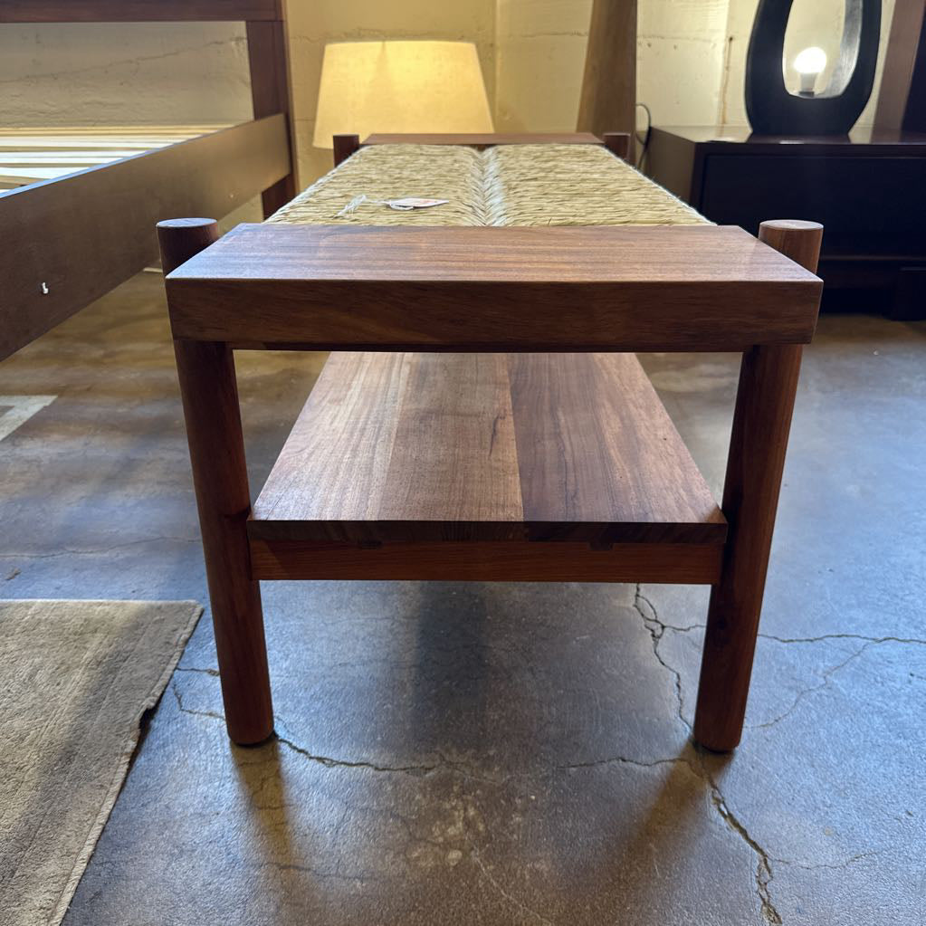 Wooden dining table with bench in a room setting