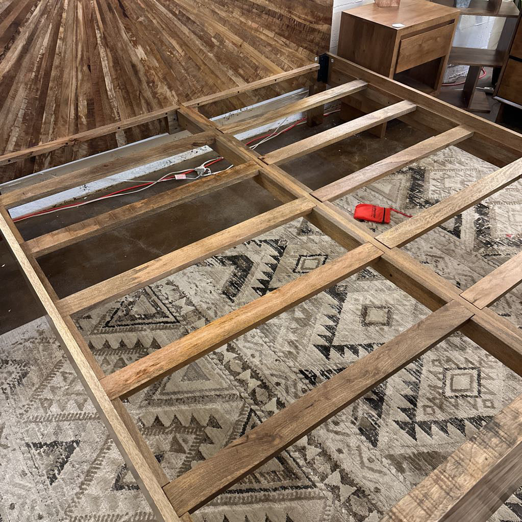 Wooden floor structure on a patterned rug