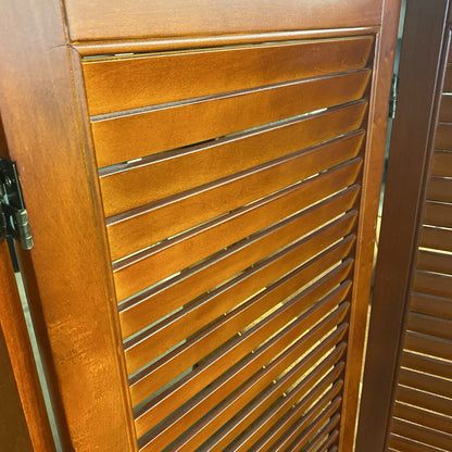 Wooden shutter with slats on a door