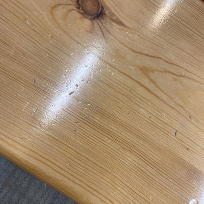 Close-up of a wooden surface with visible grain and texture