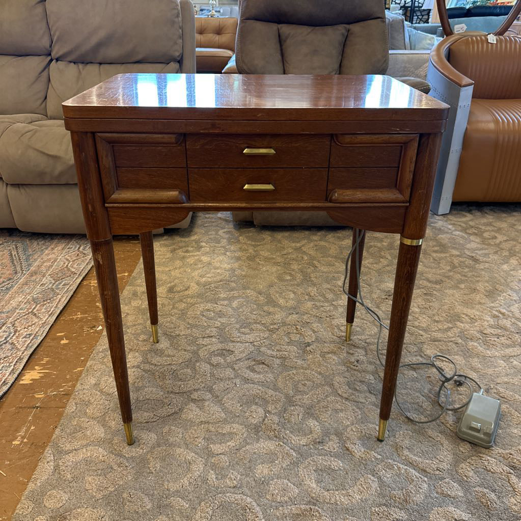 Wooden side table with drawers in a living room setting