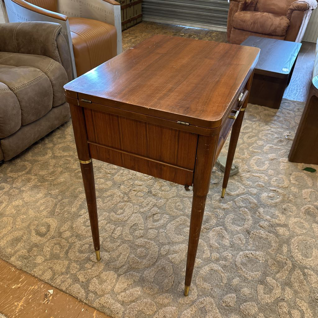 Wooden side table in a room with furniture and carpet
