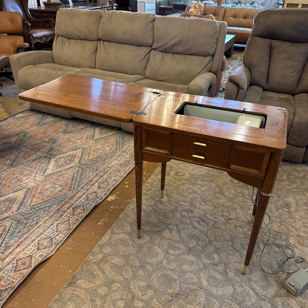 Wooden side table with a built-in sink in a living room setting