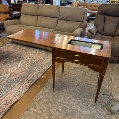Wooden side table with a built-in sink in a living room setting