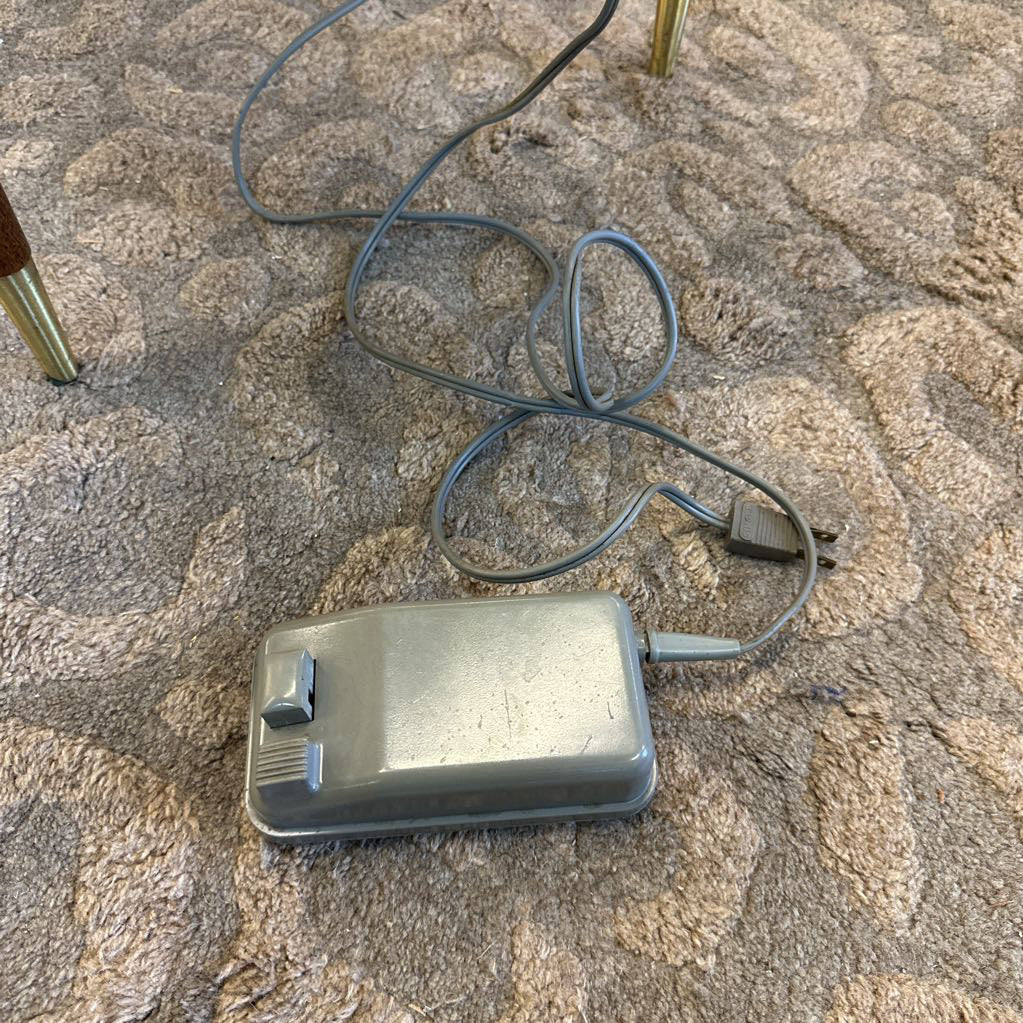 Rectangular electronic device with a cord on a textured surface