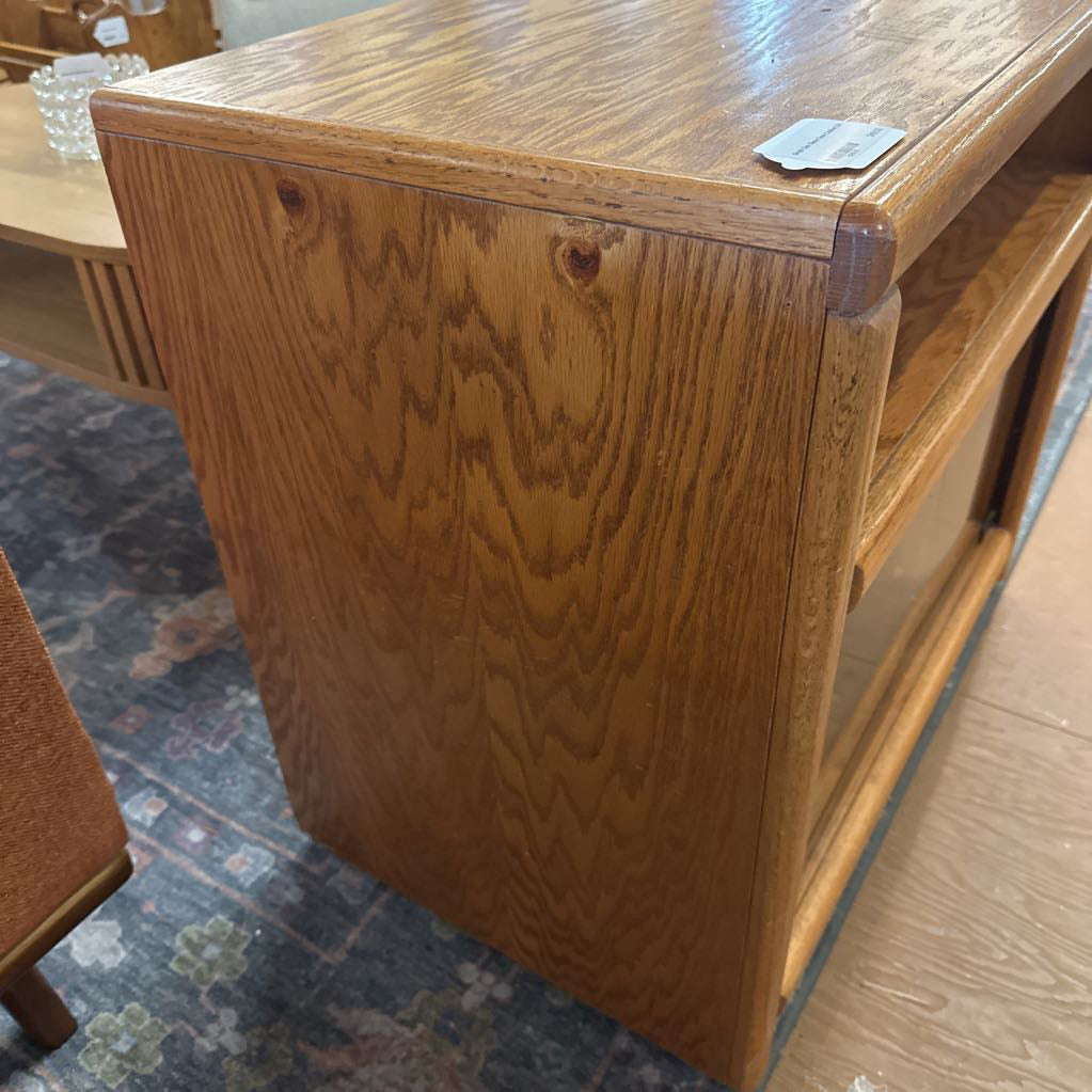 Wooden desk with a textured surface on a patterned floor