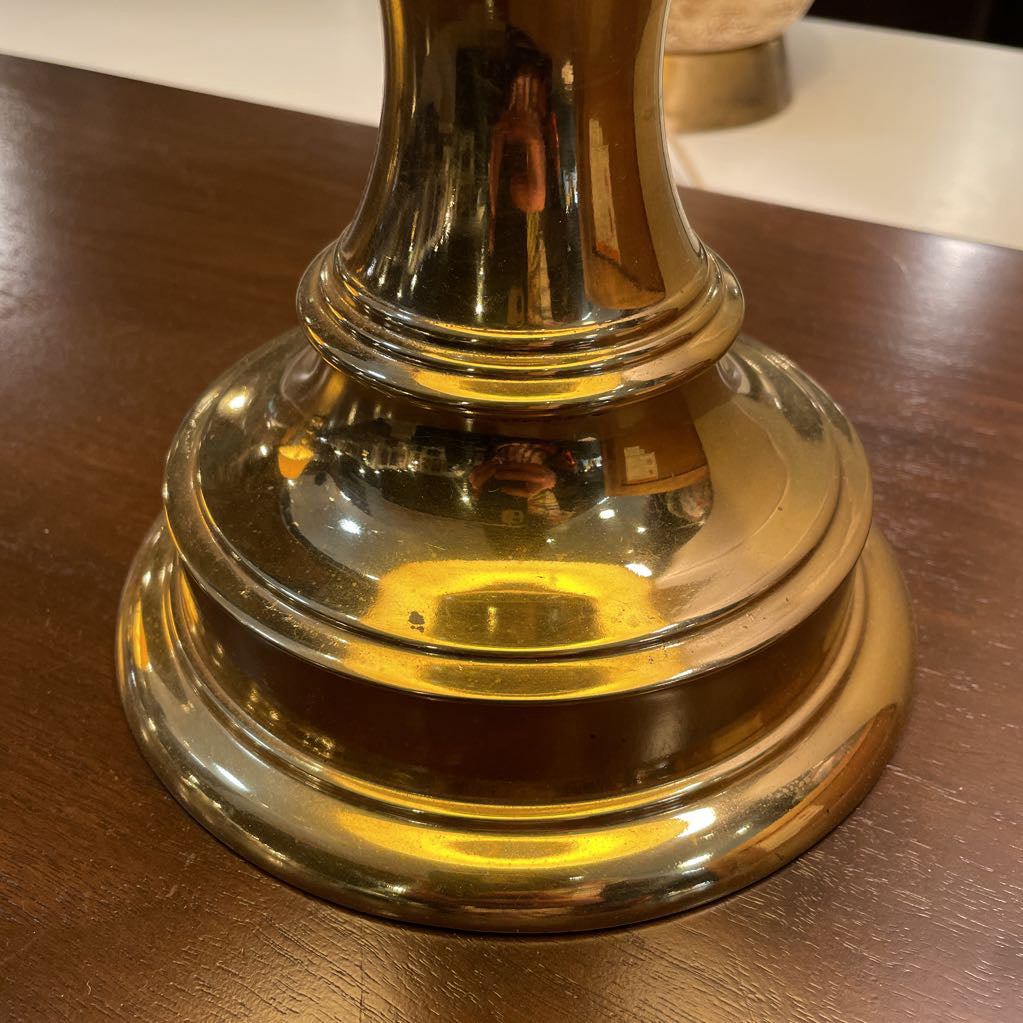 Gold bell on a wooden surface