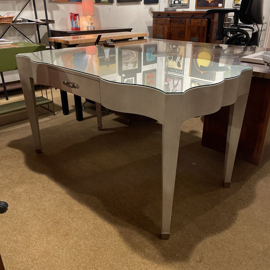 Dining table with glass top in a room with furniture and decor