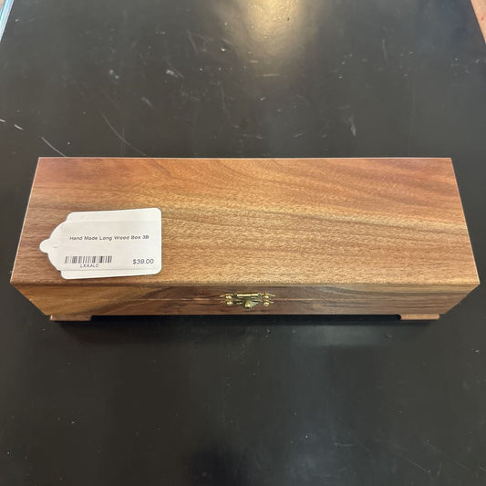 Wooden box with a label on a black surface