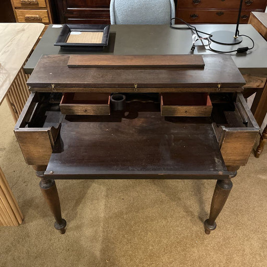 Wooden desk with drawers in a room setting