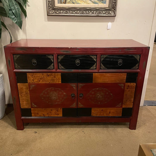 Wooden console table with decorative design in a room setting