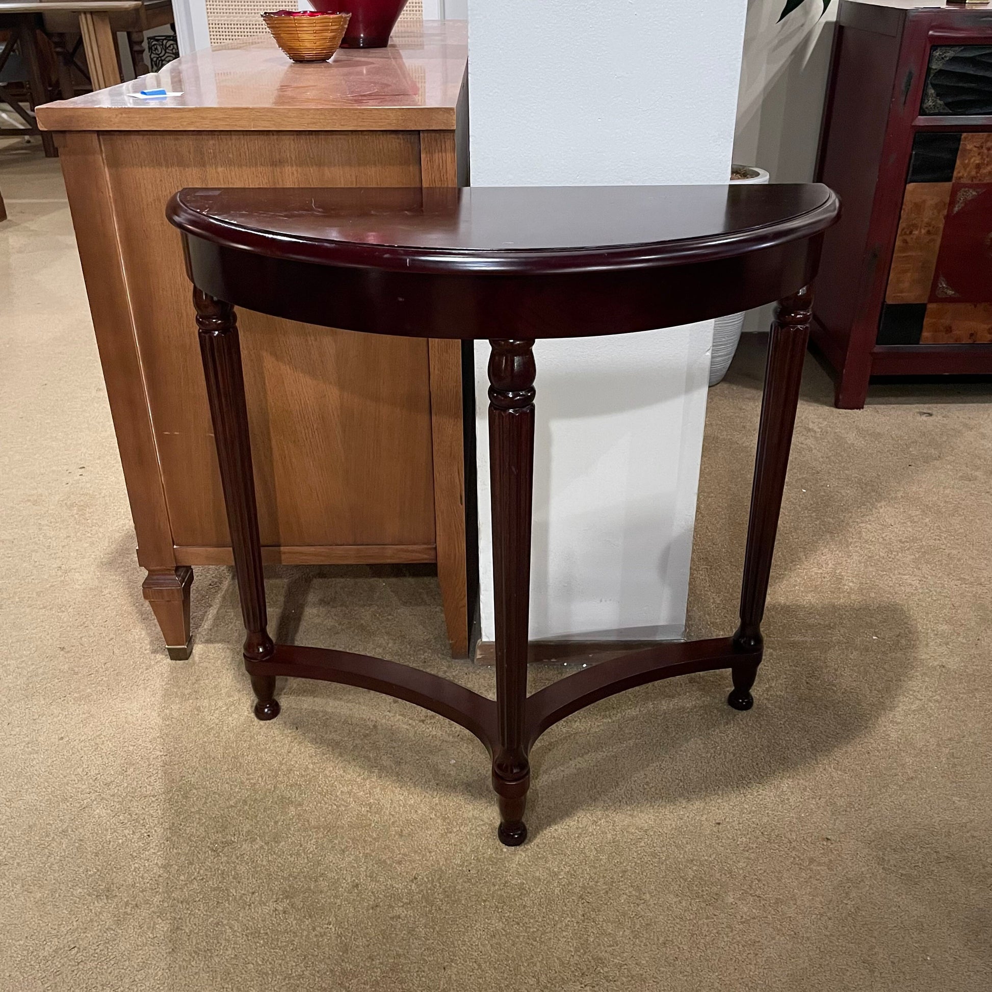 Wooden side table in a room with furniture