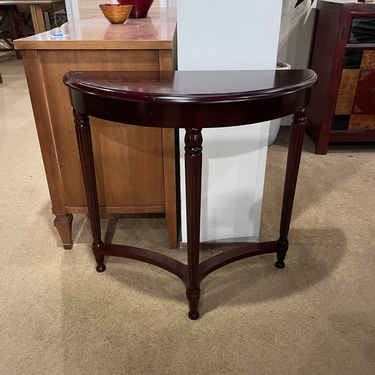 Wooden side table in a room with furniture