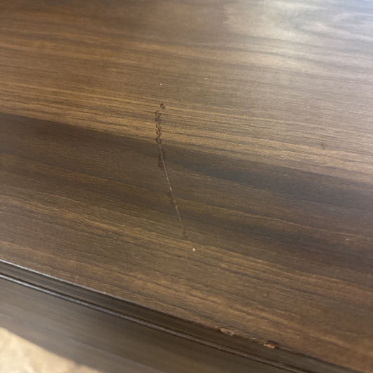 Close-up of a wooden surface with a scratch