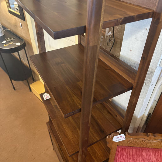 Wooden shelf with a price tag in an indoor setting