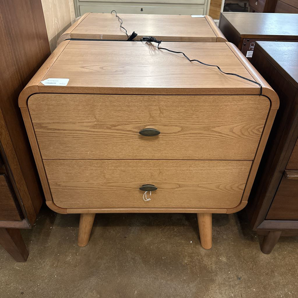 Wooden nightstand with two drawers in a store setting