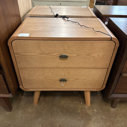 Wooden nightstand with two drawers in a store setting