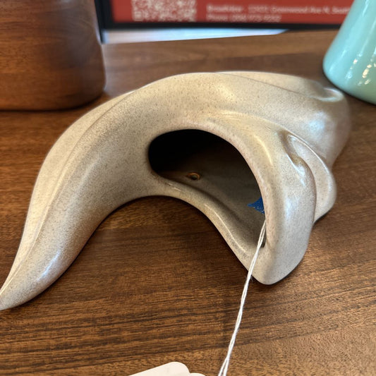 Tea bag holder on a wooden surface with a blurred background
