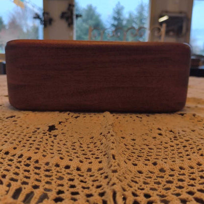 Brown textured box on a lace tablecloth with a blurred background