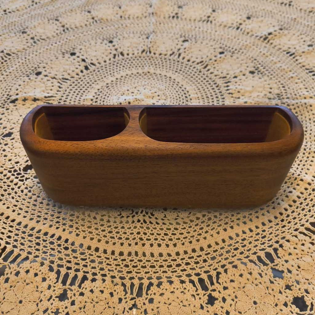 Wooden desk organizer on a textured surface