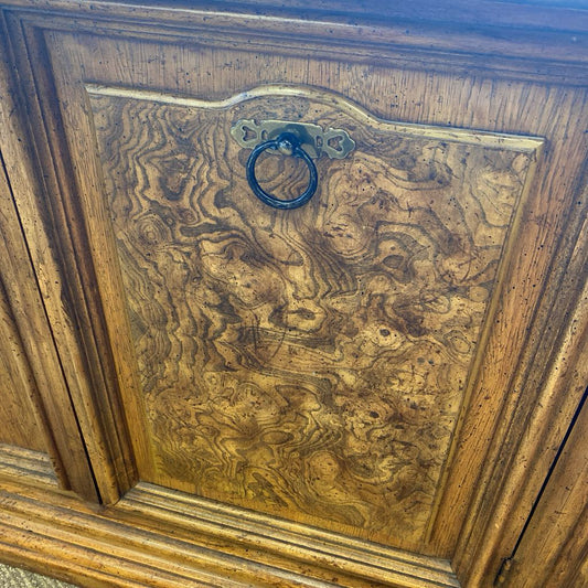 Wooden cabinet door with a decorative ring handle