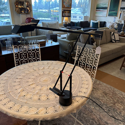 Round table with a decorative crochet cover in a living room setting