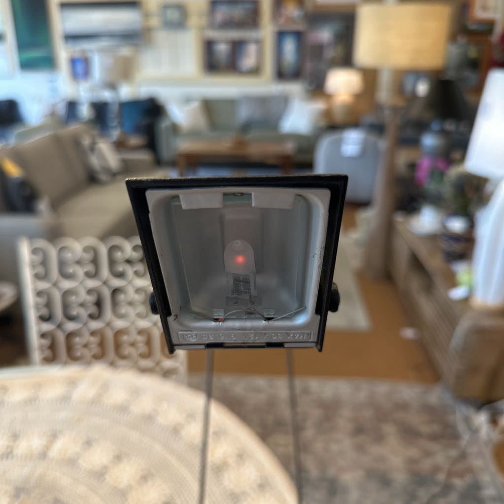 Light bulb with a blurred living room in the background
