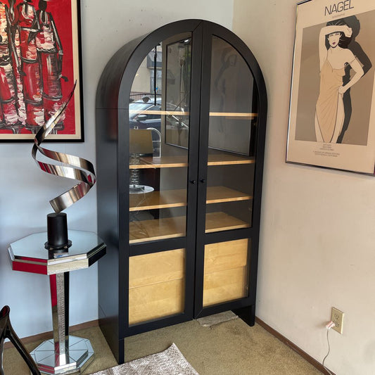 Black Arch Glass Front Cabinet with Light Wood Shelving