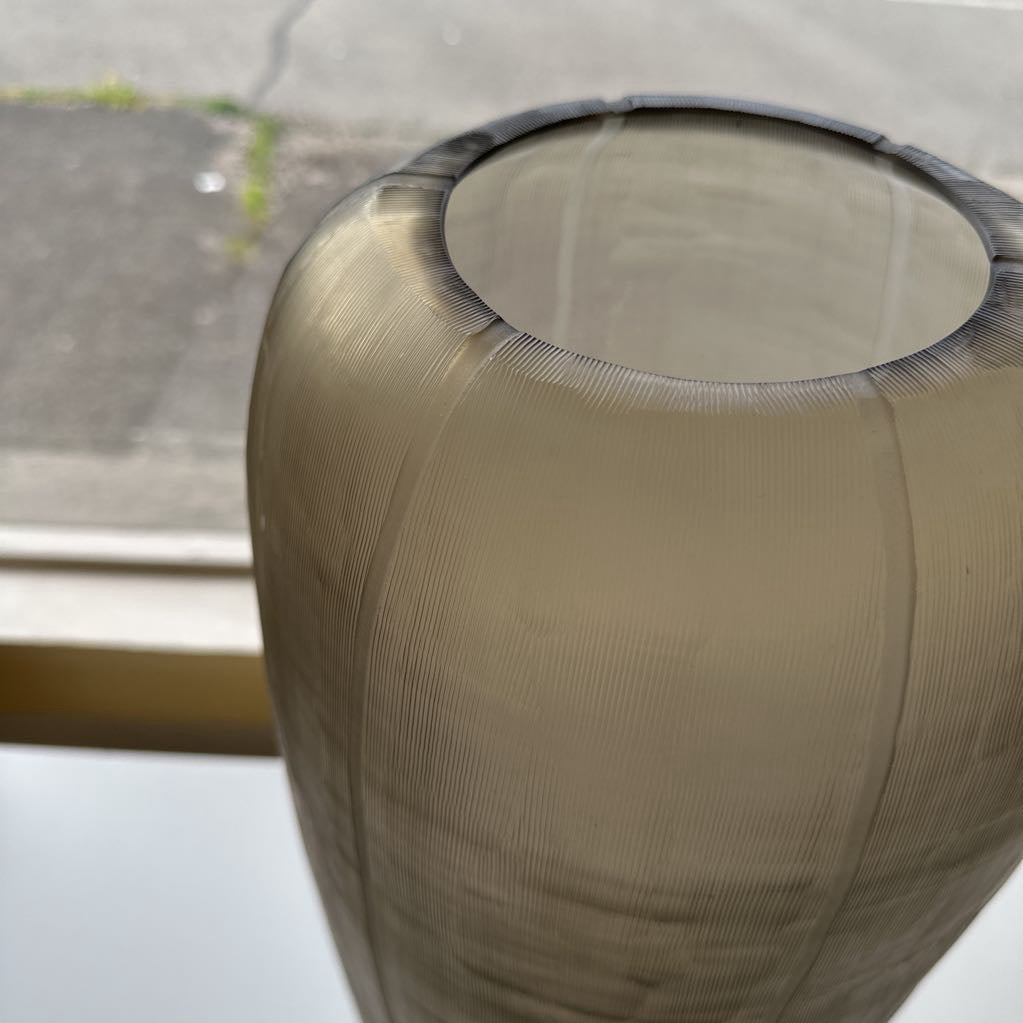 Close-up of a textured brown cylindrical object with a blurred background