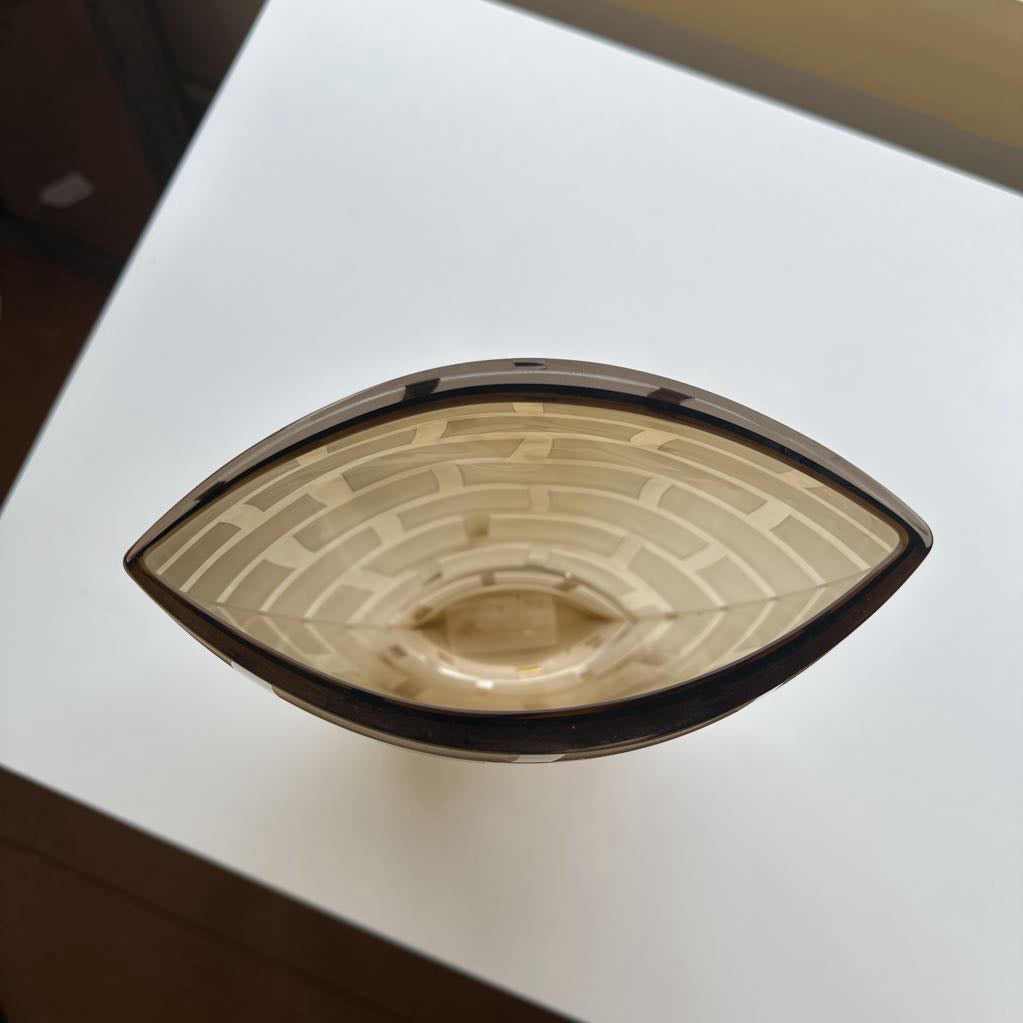 Decorative bowl with geometric pattern on a white surface