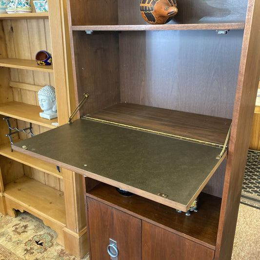 Wooden shelf with a folding green writing surface