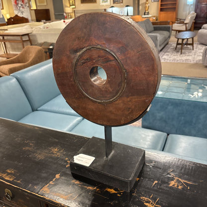 Rustic Wood Wheel Mounted On Black Stand