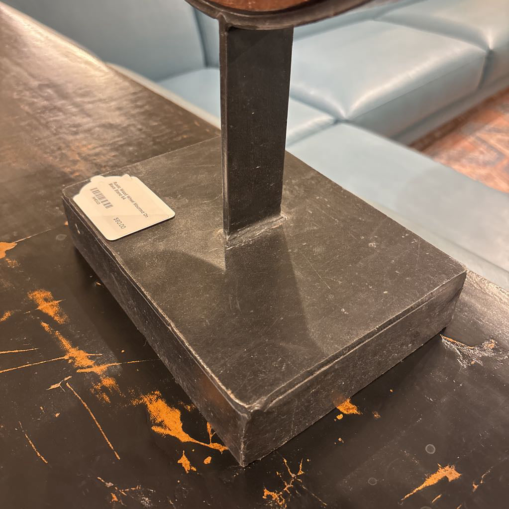 Rustic Wood Wheel Mounted On Black Stand