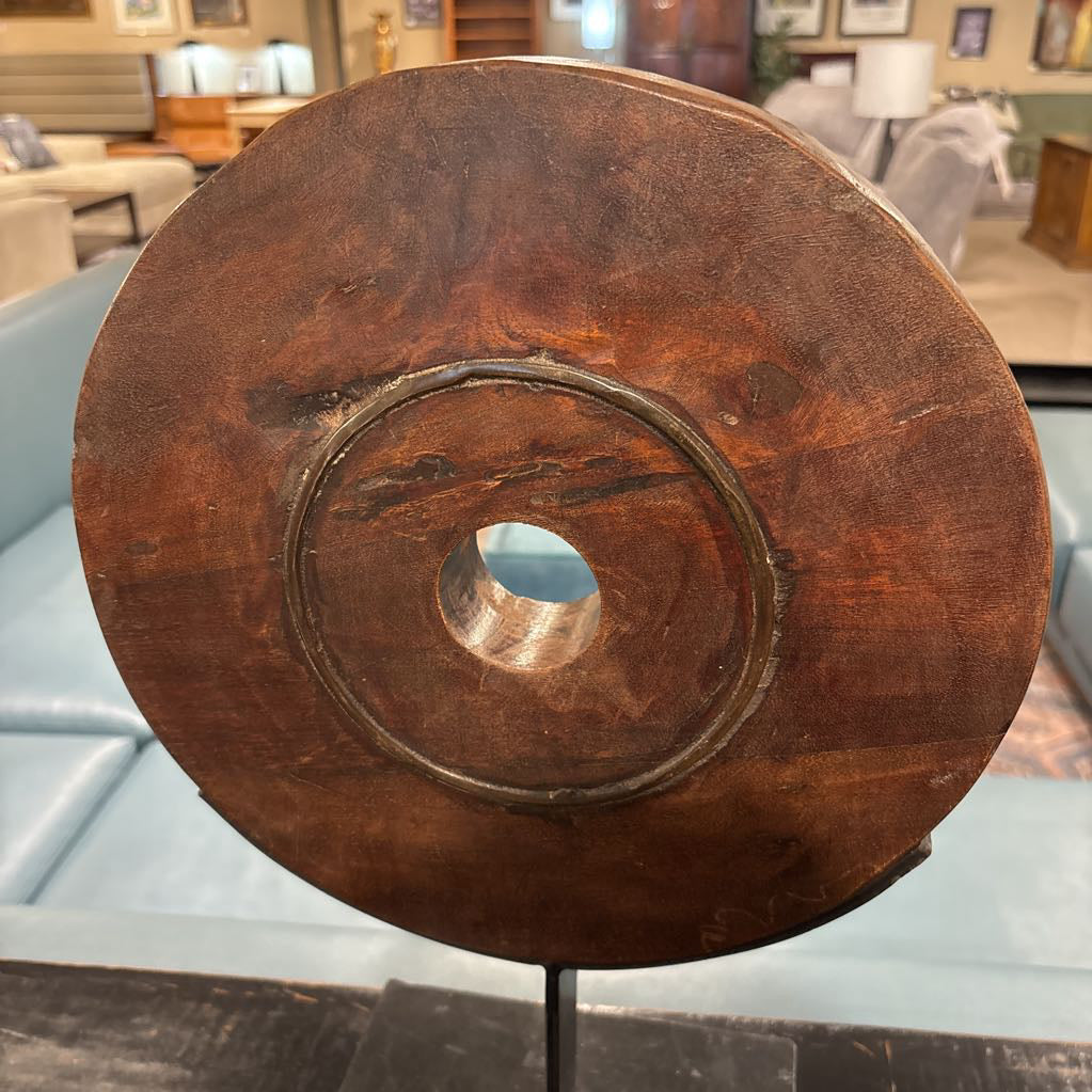 Rustic Wood Wheel Mounted On Black Stand